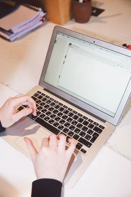 Man analyzing marketing content strategies using sticky notes on a whiteboard.